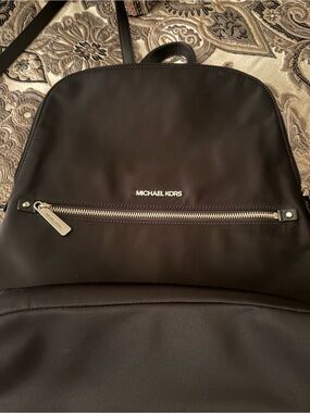 Woman’s Michael Kors Black Nylon Backpack with Silver Hardware